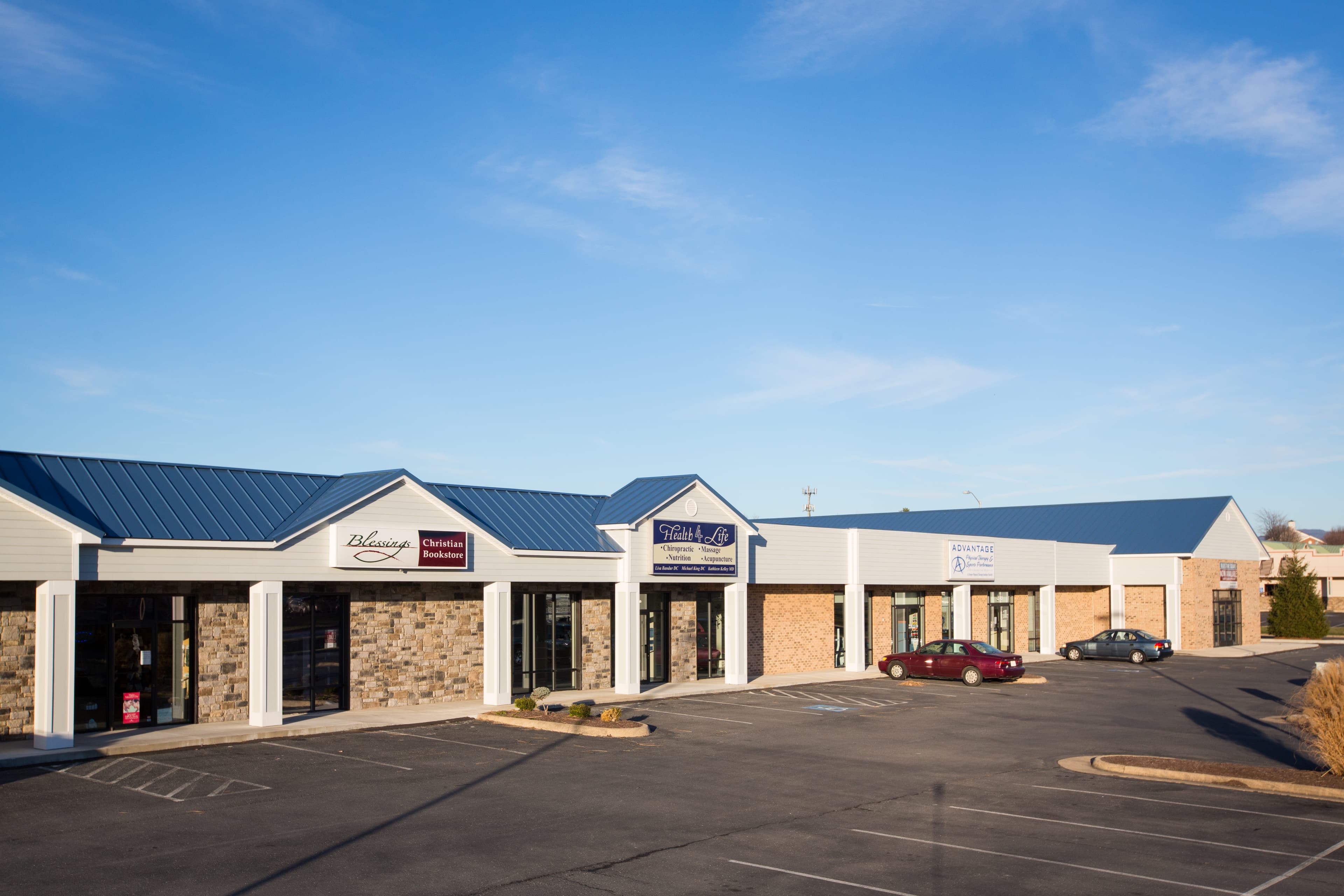 Exterior of Bluestone Evergreen Plaza at dusk